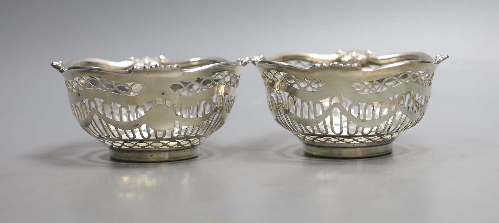 A pair of Edwardian Scottish pieced silver bonbon dishes, Hamilton & Inches, Edinburgh, 1902, diameter 10.6cm, 206 grams.